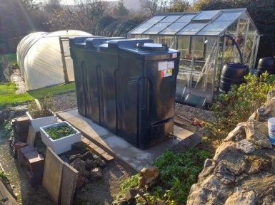 Oil tank near a greenhouse